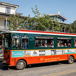 Trolley_250x250 red and green trolley filled with tourists in cape may new jersey