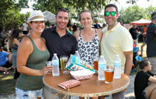 4 friends enjoying beer and festival foods at the cape may mac Craft beer, Music & Crab Festival