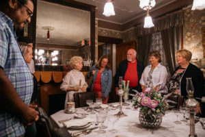 victorian dressed tour guide giving a tour in the emlen physick estate dining room