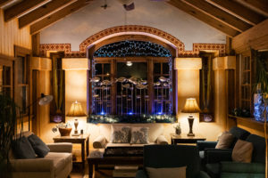 A window lit up with some fish at the Mission Inn in Cape May New Jersey