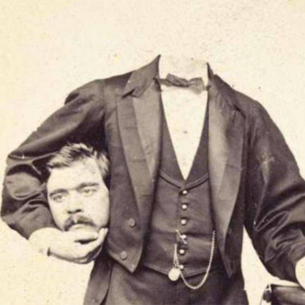 ghostly victorian man holding his own head