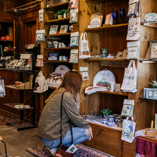 Shop-1500×700 a girl shopping at the Cape May Mac Carriage House Museum Gift shop