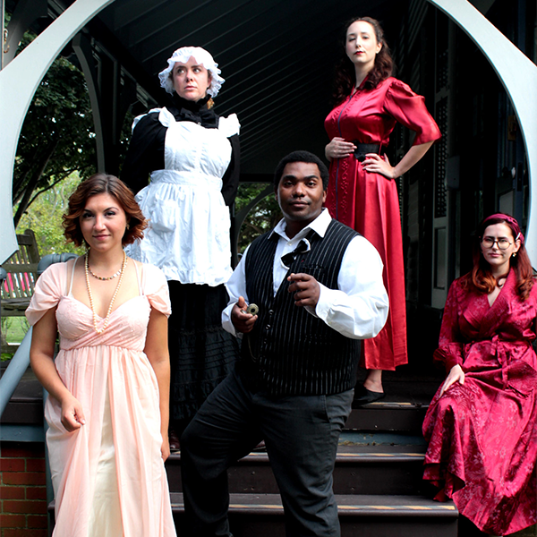 5 people dressed in victorian attire