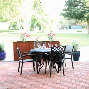 Table at Vintage BYOB An outdoor restaurant table and chairs