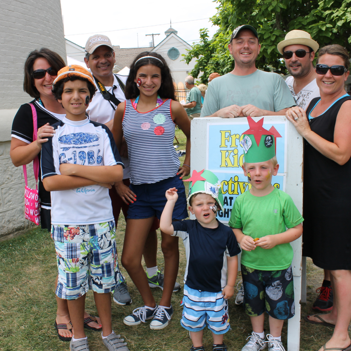 Family Fun Day at LH Family a family gathered outside of the cape may lighthouse