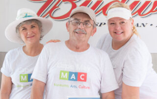 three volunteers posing for a photo