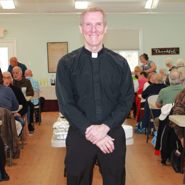 VOM April 23 Pastor Jeff Elliott photo of a pastor smiling in a church hall