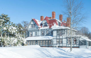 victorian house in the snow
