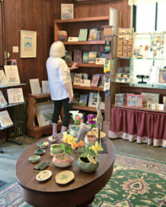 photo of a woman in a shop looking at books