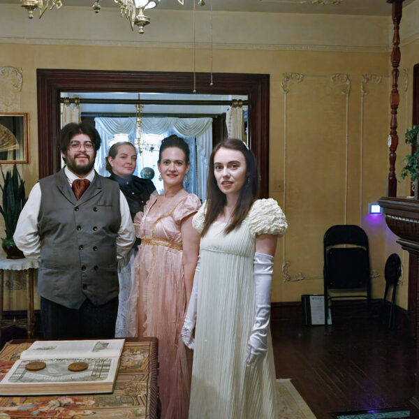 54615062702_e845e86b1d_k people in victorian dress standing in a parlor