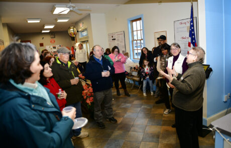 woman speaking to a crowd of people