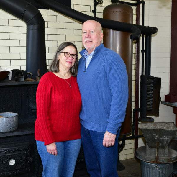 a photo of a man and a woman in a Victorian kitchen