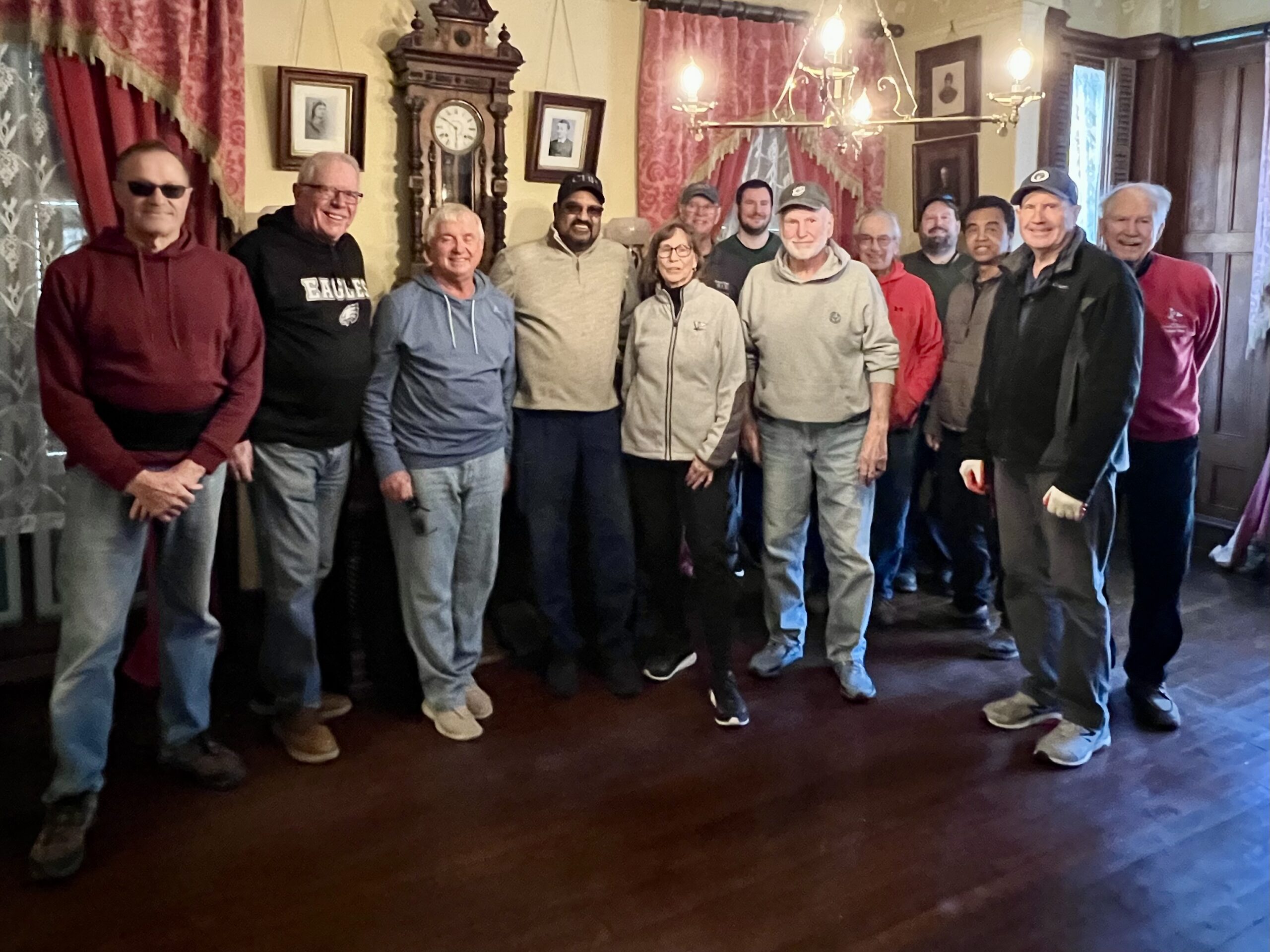 a group of people in a victorian house