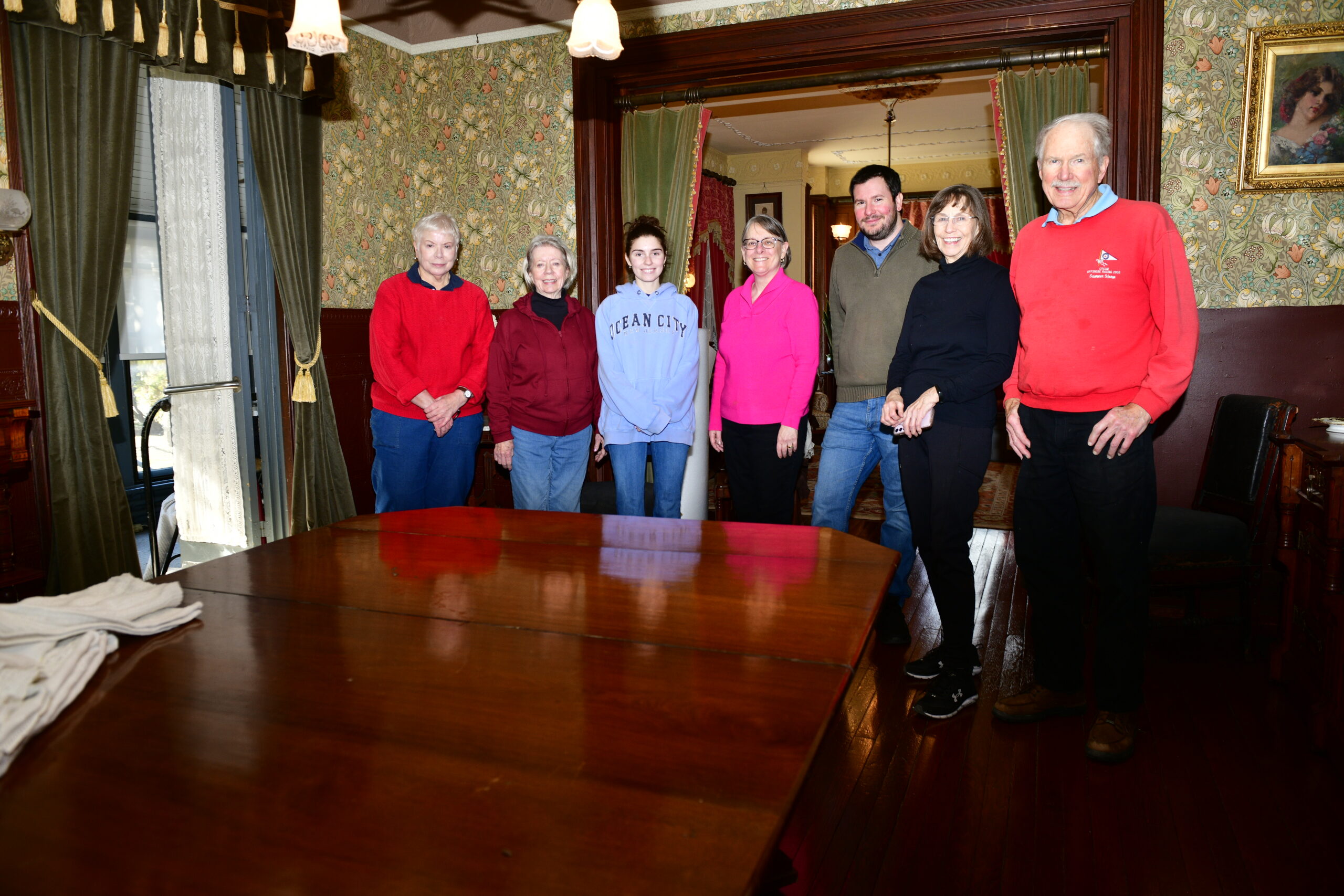 a group of people in a victorian house